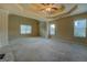 Spacious main bedroom offers tray ceilings and tons of natural light at 1186 Diamond Xing, Mcdonough, GA 30252