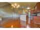 Spacious open floor plan connecting the kitchen and living area with hardwood floors and high ceilings at 1186 Diamond Xing, Mcdonough, GA 30252
