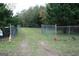 Gated driveway entrance with a 'For Sale' sign, marking the entry to a private property at 2171 Highway 42 S, Mcdonough, GA 30253