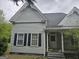 Charming home featuring classic architecture with black shuttered windows and cozy front porch at 2171 Highway 42 S, Mcdonough, GA 30253