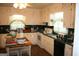 A traditional kitchen featuring white cabinets and appliances with retro decor and ample counter space at 2171 Highway 42 S, Mcdonough, GA 30253