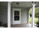 Cozy porch with a storm door, offering a private outdoor space with natural light at 2171 Highway 42 S, Mcdonough, GA 30253