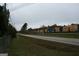 A rural street view, showcasing train cars and the surrounding landscape under a cloudy sky at 2171 Highway 42 S, Mcdonough, GA 30253