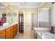 Bathroom with a soaking tub, shower, double sinks and ample counter space at 5015 Kings Common Way, Cumming, GA 30040