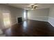 Comfortable living room featuring a fireplace and wood-look floors, perfect for relaxation at 10988 Mansura Pl, Hampton, GA 30228