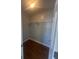 A walk-in closet with wooden floors and metal shelving at 10988 Mansura Pl, Hampton, GA 30228