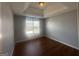 Bright bedroom featuring tray ceilings, a window, and neutral paint at 10988 Mansura Pl, Hampton, GA 30228