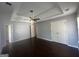 Large main bedroom boasts tray ceilings, a ceiling fan, and a walk-in closet at 10988 Mansura Pl, Hampton, GA 30228