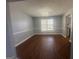Dining room features wood-look floors, chair rail, and an elegant chandelier at 10988 Mansura Pl, Hampton, GA 30228