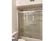 Clean bathroom featuring a shower-tub combination with sliding glass doors and modern fixtures at 2978 Parc Lorraine # Building 4, Lithonia, GA 30038