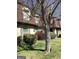Charming townhome exterior with well-maintained landscaping and a mature tree in the front yard at 2978 Parc Lorraine # Building 4, Lithonia, GA 30038