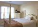 Bedroom with a four poster bed, white dresser and natural light at 300 Legacy Ln, Peachtree City, GA 30269
