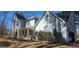 Traditional home with an attached garage, well-maintained lawn, and welcoming front porch with seating at 300 Legacy Ln, Peachtree City, GA 30269
