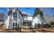 Charming two-story traditional home with a well-manicured lawn and inviting front porch seating at 300 Legacy Ln, Peachtree City, GA 30269