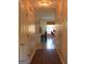 Hallway view into the kitchen and dining area, showcasing a seamless flow and bright spaces at 300 Legacy Ln, Peachtree City, GA 30269