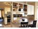 Bright kitchen with stainless steel appliances, white cabinetry, and an open breakfast bar area at 300 Legacy Ln, Peachtree City, GA 30269