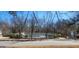 Community pool area featuring a pool house, and a pool with lounge chairs at 300 Legacy Ln, Peachtree City, GA 30269