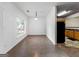 Open dining room area with a window and view into the kitchen with black appliances at 2523 Walden Lake Dr, Decatur, GA 30035