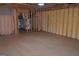 Unfinished basement featuring wooden beams, spray foam insulation, and a doorway at 195 Twin Oaks Dr, Hampton, GA 30228