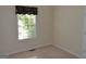 Bright bedroom featuring a window, neutral walls, and carpet flooring at 195 Twin Oaks Dr, Hampton, GA 30228