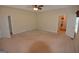 Spacious main bedroom features neutral carpet, ceiling fan, and ensuite bathroom at 195 Twin Oaks Dr, Hampton, GA 30228