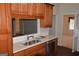 Traditional kitchen featuring wood cabinets, stainless steel appliances, and a double basin sink at 195 Twin Oaks Dr, Hampton, GA 30228