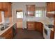 Well-equipped kitchen featuring wooden cabinetry and modern appliances at 195 Twin Oaks Dr, Hampton, GA 30228