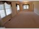 Bright and airy living room with neutral carpet and large windows at 195 Twin Oaks Dr, Hampton, GA 30228