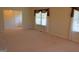 Spacious living room with plush carpet and large windows with blinds at 195 Twin Oaks Dr, Hampton, GA 30228