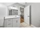 Modern bathroom with white cabinets and a view to the hallway, stairs, and open concept living space at 3185 Tackett Rd, Douglasville, GA 30135