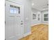 Bright entryway showcasing hardwood floors and a clear view of the home's interior and abundant natural light at 3195 Tackett Rd, Douglasville, GA 30135