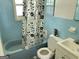 Cozy bathroom featuring a bathtub, toilet, and classic sink with storage at 439 Oakside Sw Dr, Atlanta, GA 30331