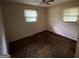 Bright bedroom with two windows, ceiling fan and carpet flooring at 439 Oakside Sw Dr, Atlanta, GA 30331