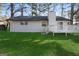 Backyard features a well-maintained lawn and white wood deck at 9317 Thomas Rd, Jonesboro, GA 30238