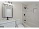 Updated bathroom with a marble-look tile shower and modern vanity at 9317 Thomas Rd, Jonesboro, GA 30238