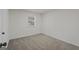 Bedroom featuring plush carpet, a window with blinds, and neutral walls at 9317 Thomas Rd, Jonesboro, GA 30238