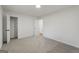 Bedroom featuring plush carpet, neutral walls, and an open closet at 9317 Thomas Rd, Jonesboro, GA 30238