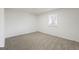 Bedroom featuring plush carpet, neutral walls, and a window with blinds at 9317 Thomas Rd, Jonesboro, GA 30238