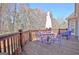 Outdoor back deck with purple patio table and chairs under a bright blue sky at 123 Fielding Rdg, Peachtree City, GA 30269