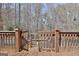 A back deck overlooks a spacious backyard with a wooded area at 123 Fielding Rdg, Peachtree City, GA 30269