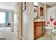 Traditional bathroom with wood vanity, granite countertops, and floral shower curtain at 123 Fielding Rdg, Peachtree City, GA 30269