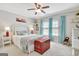 Comfortable bedroom featuring a white wicker bed, wood accents, and bright window light at 123 Fielding Rdg, Peachtree City, GA 30269