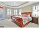 Spacious bedroom offers natural light from three windows with custom shutters and a ceiling fan at 123 Fielding Rdg, Peachtree City, GA 30269