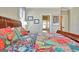 Comfortable bedroom with colorful bedspread and en suite bathroom featuring a soaking tub at 123 Fielding Rdg, Peachtree City, GA 30269