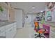 This finished craft room features under cabinet lighting, neutral walls and flooring at 123 Fielding Rdg, Peachtree City, GA 30269