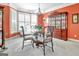 Bright dining room with a glass table, ornate chairs and a built-in display case at 123 Fielding Rdg, Peachtree City, GA 30269