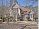 Charming two-story home with a manicured lawn and purple shutters adding a pop of color at 123 Fielding Rdg, Peachtree City, GA 30269