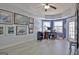 This home office features blue accent wall and lots of light from multiple windows at 123 Fielding Rdg, Peachtree City, GA 30269