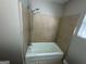 Tiled bathtub and shower combination in bathroom at 3859 Rosedale Ln, Douglasville, GA 30135