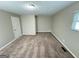 Cozy bedroom offering neutral carpeting and a closet for storage at 3859 Rosedale Ln, Douglasville, GA 30135